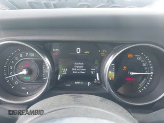 2023 Jeep Wrangler Sahara with VIN 1C4JJXP69PW695915, listed as a IAAI auction lot 42662028 with 36,957 mi miles and . Bid and sale history available at DreamBid. Image 7.