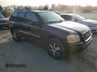 2004 GMC Envoy SLT with VIN 1GKDT13S942407244, listed as a Copart auction lot 70995064 with 162,676 mi miles and Salvage Title. Bid and sale history available at carsss.com. Image 4.
