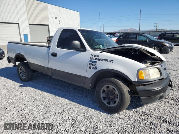2000 Ford F-150 XL with VIN 2FTPF17Z5YCA99717, listed as a Copart auction lot 70658194 with Not provided miles and Salvage title. Bid and sale history available at DreamBid. Image 4.