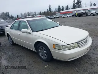 2003 Cadillac Seville Luxury SLS z VIN 1G6KS54Y43U120481, wystawiony jako IAAI lot #41637413 z przebiegiem 46 598 mil mil oraz . Historia ofert i sprzedaży dostępna na DreamBid. Obrazek 1.