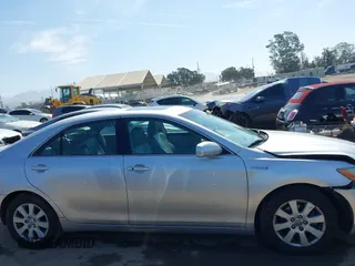 2008 Toyota Camry z VIN 4T1BB46K48U057742, wystawiony jako IAAI lot #42334365 z przebiegiem 210 090 mil mil oraz . Historia ofert i sprzedaży dostępna na DreamBid. Obrazek 13.