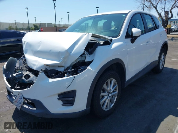2016 Mazda CX-5 Sport with VIN JM3KE2BY9G0825285, listed as a IAAI auction lot 41841833 with 96,915 mi miles. Bid and sale history available at carsss.com. Image 17.