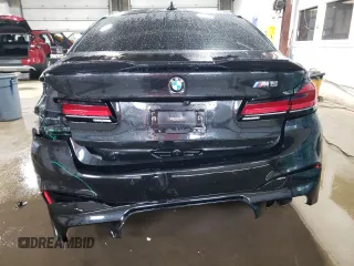 2018 BMW M5 z VIN WBSJF0C51JB282271, wystawiony jako Copart lot #60647265 z przebiegiem 63 765 mil mil oraz Szkoda całkowita • Salvage title. Historia ofert i sprzedaży dostępna na DreamBid. Obrazek 6.