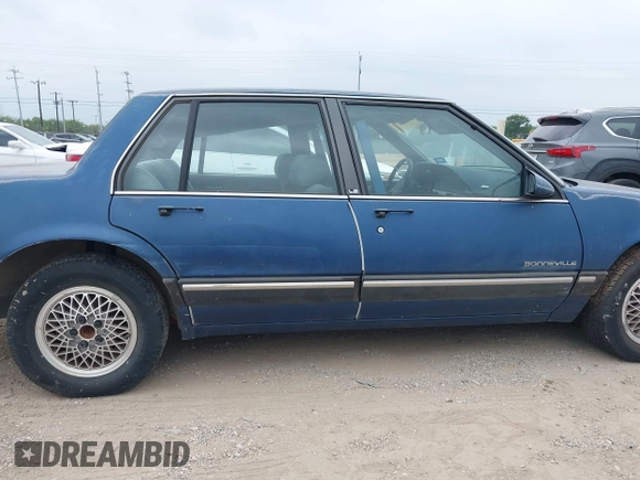 1990 Pontiac Bonneville z VIN 1G2HX54C6L1204370, wystawiony jako IAAI lot #42283309 z przebiegiem 114 427 mil mil oraz . Historia ofert i sprzedaży dostępna na DreamBid. Obrazek 13.