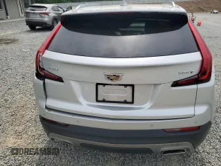 2021 Cadillac XT4 FWD Premium Luxury z VIN 1GYFZCR40MF000293, wystawiony jako Copart lot #58710565 z przebiegiem 49 721 mil mil oraz Szkody całkowita. Historia ofert i sprzedaży dostępna na DreamBid. Obrazek 6.