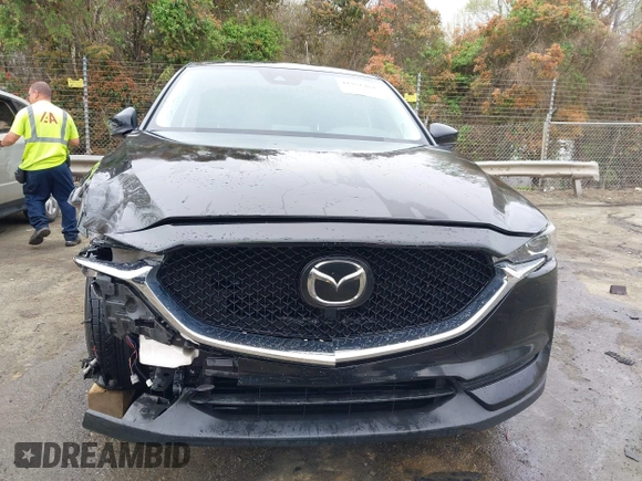 2020 Mazda CX-5 Touring with VIN JM3KFACM9L0770933, listed as a IAAI auction lot 41921464 with 75,997 mi miles. Bid and sale history available at carsss.com. Image 12.