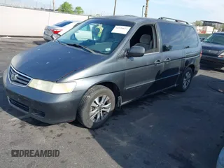 2002 Honda Odyssey EX with VIN 2HKRL18632H512158, listed as a IAAI auction lot 42354621 with 240,373 mi miles and . Bid and sale history available at DreamBid. Image 2.