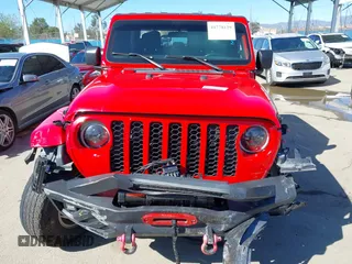 2022 Jeep Gladiator Willys Sport z VIN 1C6HJTAG0NL180848, wystawiony jako IAAI lot #41778129 z przebiegiem Nie podano mil oraz . Historia ofert i sprzedaży dostępna na DreamBid. Obrazek 13.