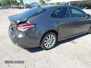 2019 Toyota Camry LE with VIN 4T1B11HK4KU286959, listed as a IAAI auction lot 42063344 with 92,481 mi miles and . Bid and sale history available at DreamBid. Image 4.