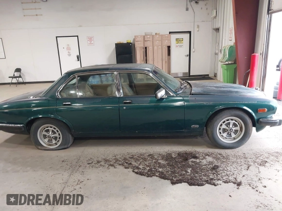 1985 Jaguar XJ with VIN SAJAV1347FC414864, listed as a IAAI auction lot 42118511 with 117,185 mi miles and . Bid and sale history available at DreamBid. Image 13.