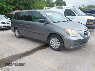 2009 Honda Odyssey LX with VIN 5FNRL38269B043326, listed as a IAAI auction lot 42872714 with 235,087 mi miles and . Bid and sale history available at DreamBid. Image 1.