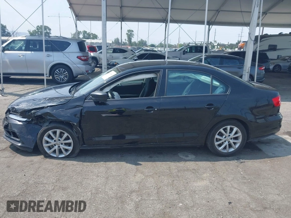 2015 Volkswagen Jetta SE z VIN 3VWD17AJXFM259306, wystawiony jako IAAI lot #42418042 z przebiegiem 199 780 mil mil oraz . Historia ofert i sprzedaży dostępna na DreamBid. Obrazek 13.