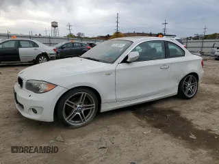 2012 BMW 1 Series 128i with VIN WBAUP7C55CVM54987, listed as a Copart auction lot 76133874 with 124,958 mi miles and Salvage title. Bid and sale history available at DreamBid. Image 1.