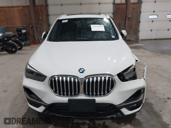 2021 BMW X1 xDrive28i with VIN WBXJG9C04M5T82884, listed as a IAAI auction lot 42242890 with 24,647 mi miles and . Bid and sale history available at DreamBid. Image 12.
