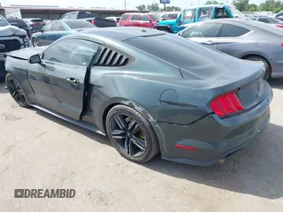 2016 Ford Mustang EcoBoost z VIN 1FA6P8TH0G5289907, wystawiony jako IAAI lot #42057565 z przebiegiem 129 917 mil mil oraz . Historia ofert i sprzedaży dostępna na DreamBid. Obrazek 3.