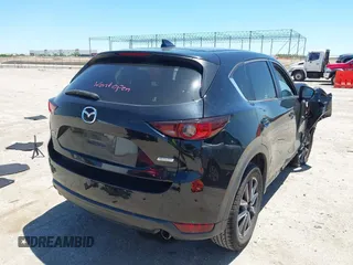 2018 Mazda CX-5 Touring z VIN JM3KFACM3J1339074, wystawiony jako IAAI lot #42317039 z przebiegiem 82 799 mil mil oraz . Historia ofert i sprzedaży dostępna na DreamBid. Obrazek 4.