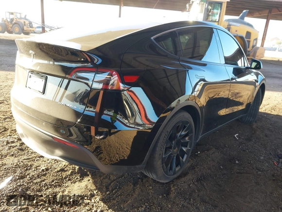 2023 Tesla Model Y Long Range with VIN 7SAYGDEE8PF815622, listed as a IAAI auction lot 41515433 with 70,862 mi miles and . Bid and sale history available at DreamBid. Image 4.
