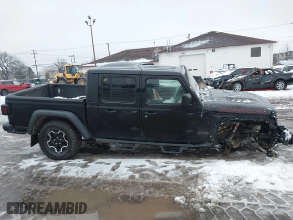 2021 Jeep Gladiator Rubicon z VIN 1C6JJTBG5ML605799, wystawiony jako IAAI lot #41190679 z przebiegiem 47 550 mil mil oraz . Historia ofert i sprzedaży dostępna na DreamBid. Obrazek 13.