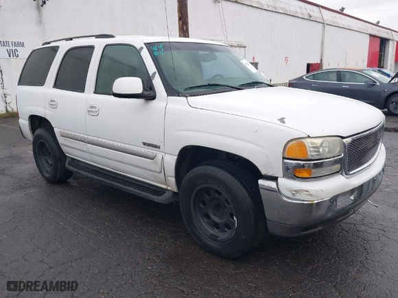 2003 GMC Yukon SLT with VIN 1GKEC13T73R281551, listed as a IAAI auction lot 41522305 with 214,489 mi miles. Bid and sale history available at carsss.com. Image 1.