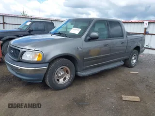 2003 Ford F-150 XLT with VIN 1FTRW07L63KC37168, listed as a IAAI auction lot 42267955 with 191,612 mi miles and . Bid and sale history available at DreamBid. Image 2.