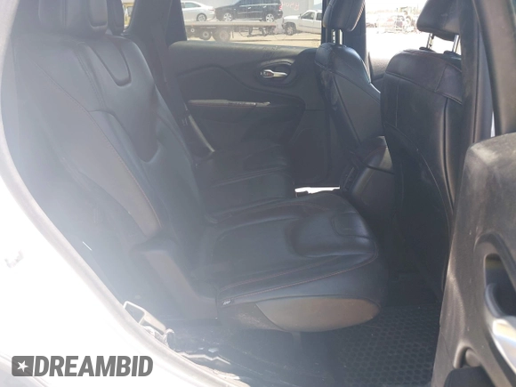 2014 Jeep Cherokee Trailhawk with VIN 1C4PJMBSXEW236807, listed as a IAAI auction lot 42660980 with 157,225 mi miles and . Bid and sale history available at DreamBid. Image 8.