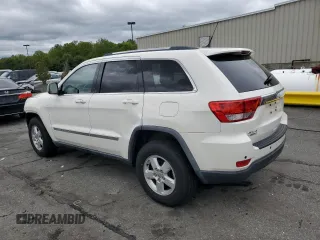 2011 Jeep Grand Cherokee Laredo with VIN 1J4RR4GG9BC515467, listed as a Copart auction lot 58411085 with 112,558 mi miles and Salvage title. Bid and sale history available at DreamBid. Image 2.