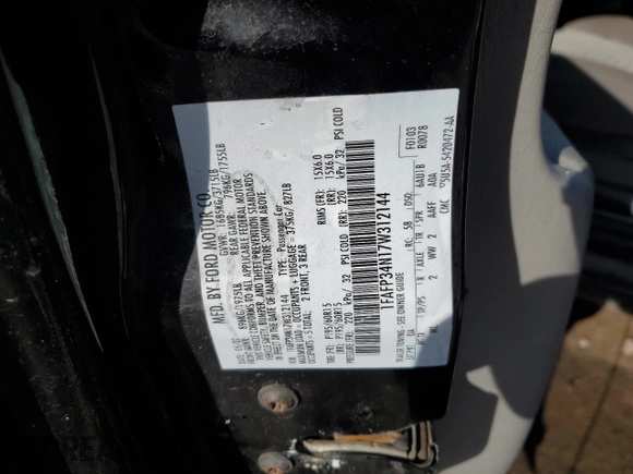 2007 Ford Focus S with VIN 1FAFP34N17W312144, listed as a Copart auction lot 51848445 with 193,049 mi miles and Salvage Title. Bid and sale history available at carsss.com. Image 13.