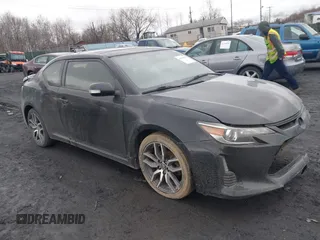2014 Scion tC with VIN JTKJF5C78E3078825, listed as a IAAI auction lot 41815615 with 187,498 mi miles. Bid and sale history available at carsss.com. Image 1.