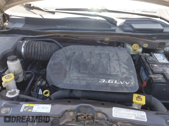 2013 Dodge Grand Caravan SE with VIN 2C4RDGBG0DR702913, listed as a IAAI auction lot 42007786 with 163,981 mi miles and . Bid and sale history available at DreamBid. Image 10.