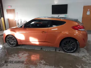 2012 Hyundai Veloster w/Gray Int z VIN KMHTC6AD6CU076954, wystawiony jako IAAI lot #41006441 z przebiegiem 73 767 mil mil oraz . Historia ofert i sprzedaży dostępna na DreamBid. Obrazek 14.