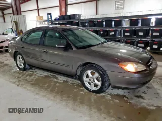 2002 Ford Taurus SES Standard z VIN 1FAFP55U72A161401, wystawiony jako Copart lot #55893125 z przebiegiem 128 258 mil mil oraz Czysty tytuł • Clean title. Historia ofert i sprzedaży dostępna na DreamBid. Obrazek 4.