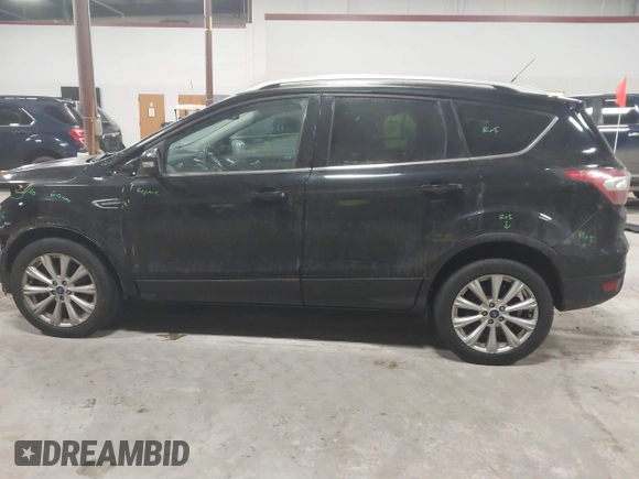 2017 Ford Escape Titanium with VIN 1FMCU9J9XHUB51401, listed as a IAAI auction lot 41025642 with 77,908 mi miles. Bid and sale history available at carsss.com. Image 14.