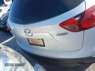 2016 Mazda CX-5 Touring z VIN JM3KE2CY9G0807688, wystawiony jako IAAI lot #41039438 z przebiegiem 169 483 mil mil oraz . Historia ofert i sprzedaży dostępna na DreamBid. Obrazek 17.