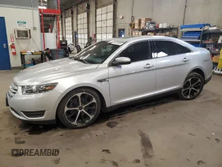 2015 Ford Taurus SEL with VIN 1FAHP2E85FG177576, listed as a Copart auction lot 54739595 with 89,156 mi miles and Salvage title. Bid and sale history available at DreamBid. Image 1.