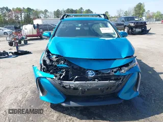 2021 Toyota Prius LE with VIN JTDKAMFP7M3180504, listed as a IAAI auction lot 41985409 with 56,617 mi miles and . Bid and sale history available at DreamBid. Image 12.