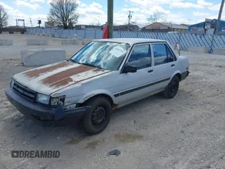 1986 Toyota Corolla с VIN JT2AE82E7G3318230, выставлен на аукционе IAAI как лот 42042219 с пробегом 74 689 миль миль и . История ставок и продаж доступна на DreamBid. Изображение 2.