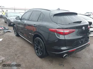 2021 Alfa Romeo Stelvio Ti with VIN ZASPAKBN0M7D02795, listed as a IAAI auction lot 41052309 with 83,584 mi miles. Bid and sale history available at carsss.com. Image 3.