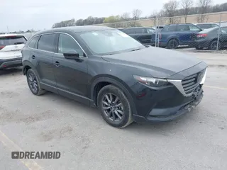 2023 Mazda CX-9 Touring with VIN JM3TCBCY3P0657538, listed as a IAAI auction lot 42024969 with 52,569 mi miles. Bid and sale history available at carsss.com. Image 1.