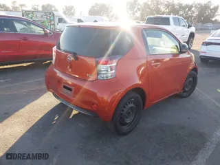 2013 Scion iQ with VIN JTNJJXB02DJ022231, listed as a IAAI auction lot 41238766 with 98,300 mi miles. Bid and sale history available at carsss.com. Image 4.