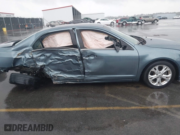 2012 Ford Fusion SE z VIN 3FAHP0HA6CR446630, wystawiony jako IAAI lot #41743485 z przebiegiem 139 547 mil mil oraz . Historia ofert i sprzedaży dostępna na DreamBid. Obrazek 14.