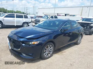 2021 Mazda 3 S z VIN JM1BPAAL6M1331460, wystawiony jako IAAI lot #42197743 z przebiegiem 53 972 mil mil oraz . Historia ofert i sprzedaży dostępna na DreamBid. Obrazek 2.