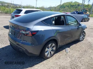 2023 Tesla Model Y Long Range z VIN 7SAYGDEE8PA191415, wystawiony jako IAAI lot #42155577 z przebiegiem 42 149 mil mil oraz . Historia ofert i sprzedaży dostępna na DreamBid. Obrazek 4.