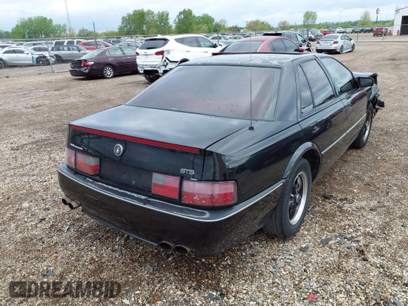 1994 Cadillac Seville STS z VIN 1G6KY5296RU823387, wystawiony jako IAAI lot #42151901 z przebiegiem 165 918 mil mil oraz . Historia ofert i sprzedaży dostępna na DreamBid. Obrazek 4.