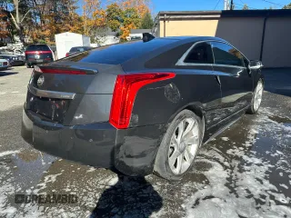 2014 Cadillac ELR z VIN 1G6RL1E44EU600913, wystawiony jako Copart lot #87106134 z przebiegiem 57 673 mil mil oraz Szkody całkowita. Historia ofert i sprzedaży dostępna na DreamBid. Obrazek 4.