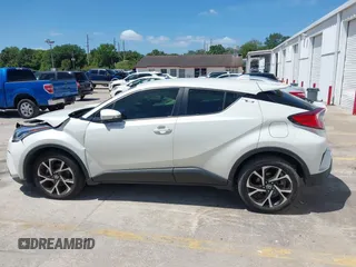 2021 Toyota C-HR LE with VIN JTNKHMBX8M1104427, listed as a IAAI auction lot 41948234 with 24,415 mi miles. Bid and sale history available at carsss.com. Image 14.