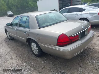 2005 Mercury Grand Marquis LS Premium with VIN 2MEFM75W35X654244, listed as a IAAI auction lot 42090783 with 120,033 mi miles. Bid and sale history available at carsss.com. Image 3.