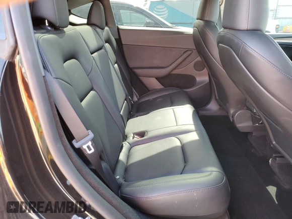 2024 Tesla Model Y with VIN 7SAYGDED0RF131495, listed as a Copart auction lot 56849765 with 10,120 mi miles and Salvage title. Bid and sale history available at DreamBid. Image 11.
