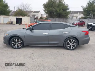 2018 Nissan Maxima S with VIN 1N4AA6AP0JC384660, listed as a IAAI auction lot 41617587 with 121,463 mi miles and . Bid and sale history available at DreamBid. Image 14.