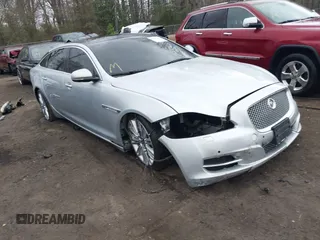 2015 Jaguar XJ with VIN SAJWA2GZ8F8V83551, listed as a IAAI auction lot 41909403 with 112,098 mi miles. Bid and sale history available at carsss.com. Image 1.