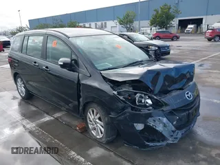 2015 Mazda 5 Sport with VIN JM1CW2BL1F0184498, listed as a IAAI auction lot 39903933 with 90,905 mi miles and . Bid and sale history available at DreamBid. Image 1.